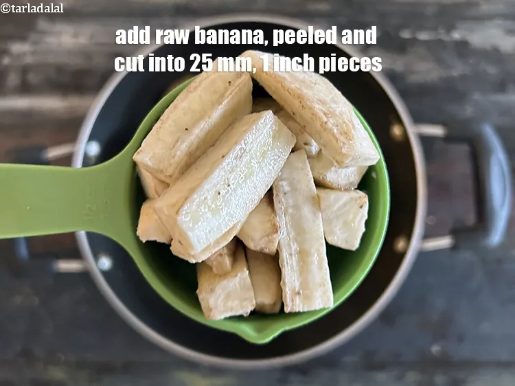 Step 18 – <meta charset="UTF-8" /> Add&nbsp;1&nbsp;<a href="glossary-raw-banana-kacha-kela-plantain-25i">raw banana</a>&nbsp;, peeled and cut into 25 mm (1&rdquo;) pieces.