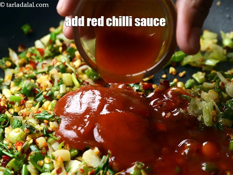 Step 19 – Add 1 tsp <a href="https://www.tarladalal.com/glossary-red-chilli-sauce-lal-chilli-sauce-810i">red chilli sauce</a>.