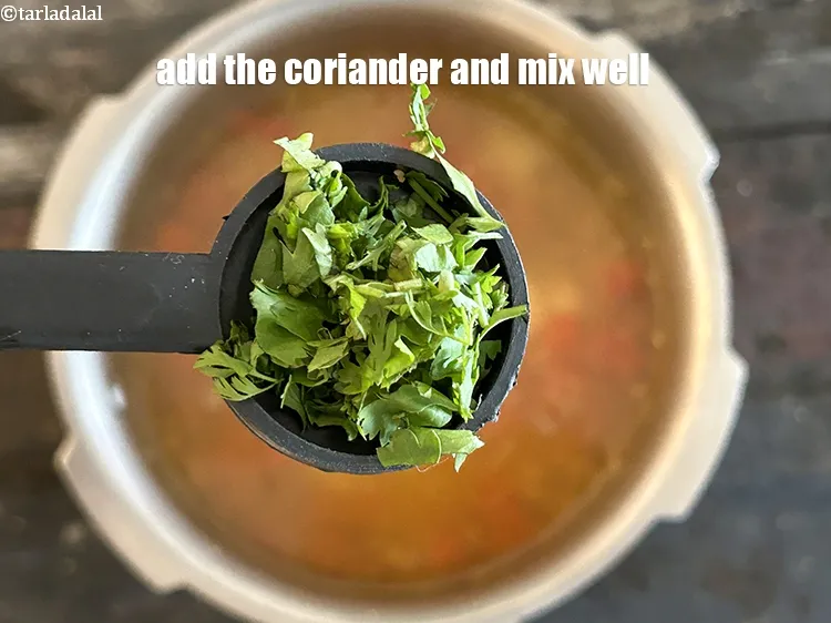 Step 21 – Add the coriander and mix well.