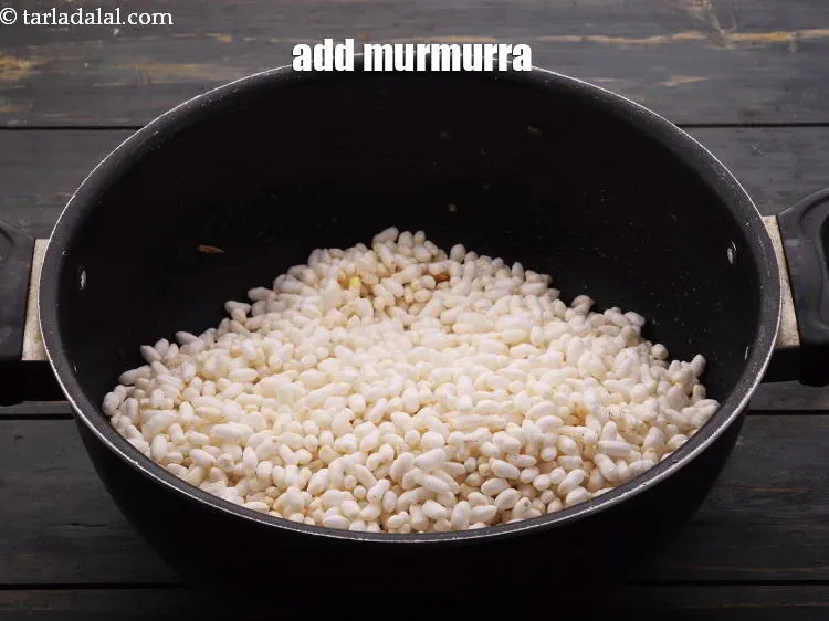Step 18 – Add&nbsp;4 cups&nbsp;<a href="https://www.tarladalal.com/glossary-thick-puffed-rice-2452i">thick puffed rice (kurmura)</a>.&nbsp;&nbsp;<strong>Bhadang Murmura</strong> is a thick variety of mumra that is …