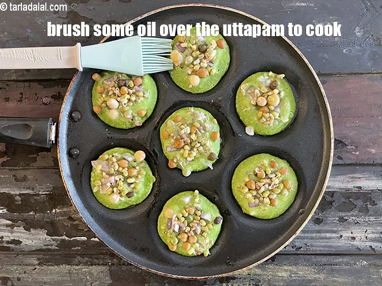 Step 25 – Brush some oil around the&nbsp;uttapam including the edges for it to&nbsp;cook.