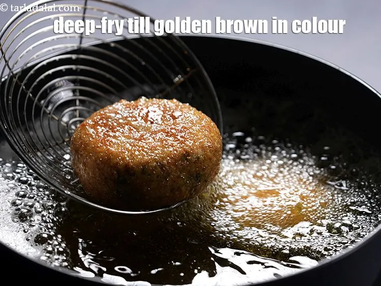 Step 24 – Deep-fry each patty till it turns golden brown in colour from both the sides.&nbsp;