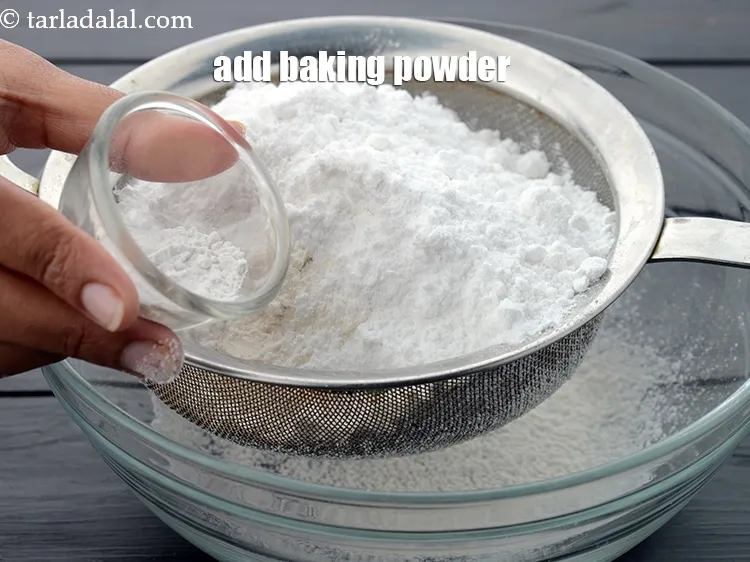 Step 18 – Add 1 tsp&nbsp;<a href="https://www.tarladalal.com/glossary-baking-powder-425i">baking powder</a>.&nbsp;