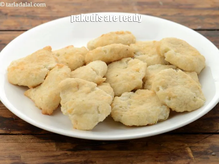 Step 50 – Repeat steps 11 to 15&nbsp;to make 1 more batch of 14 pakodis. So in all …