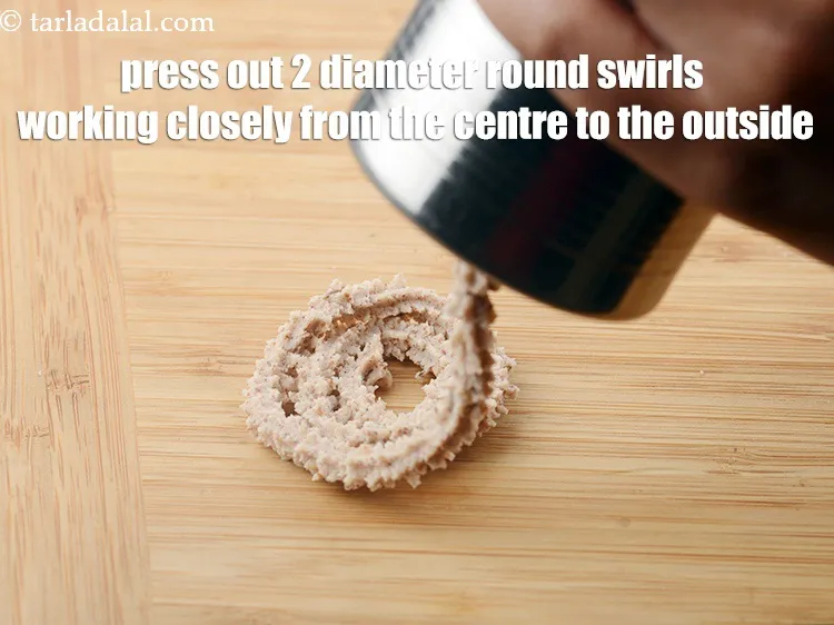 Step 18 – Press out round swirls of the dough onto a dry, flat surface, working closely from …