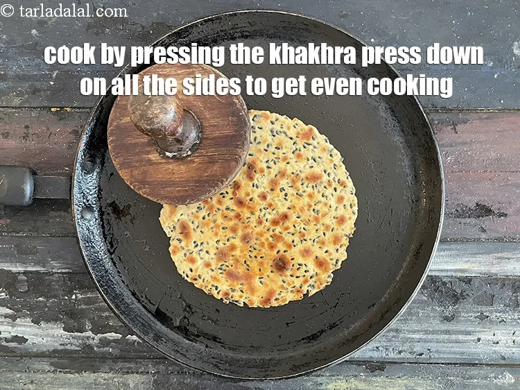 Step 17 – Cook the khakhra by using a khakra press and pressing down on all the sides …
