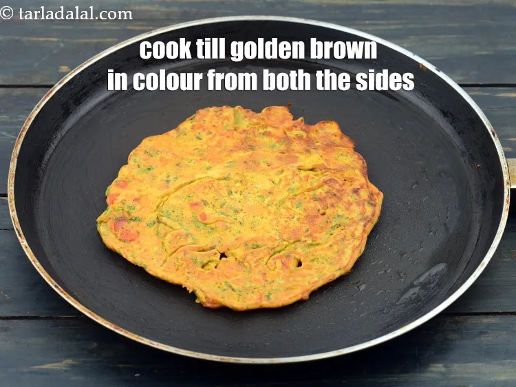 Step 19 – Cook on a medium flame till golden brown spots appear on both the sides. The …