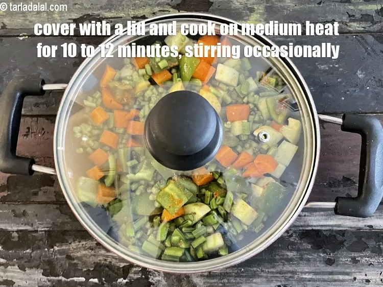 Step 28 – Cover with a lid and cook on a medium flame for 10 to 12 minutes, …