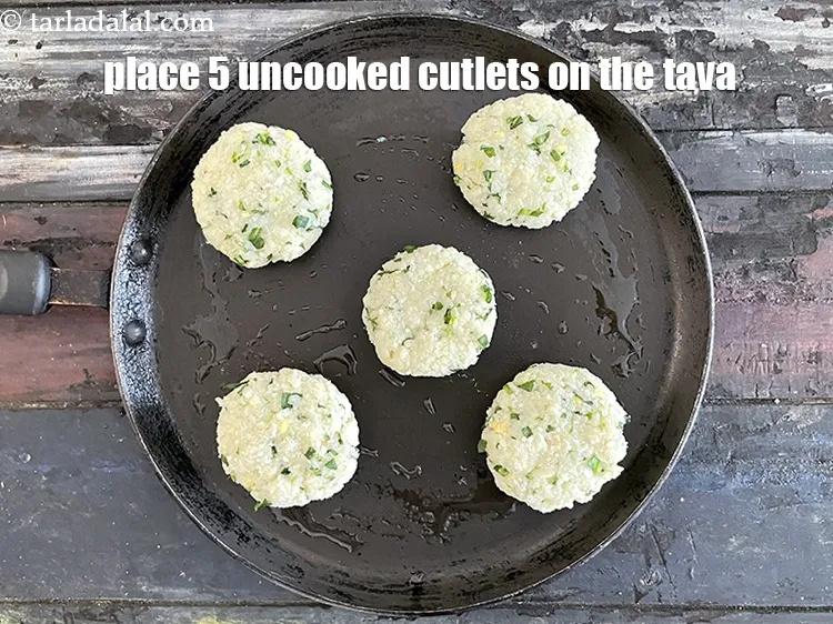Step 30 – <p>Place 5 uncooked cutlets on the hot tava. The balance 5 can be cooked in …