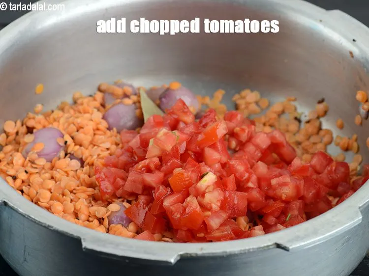 Step 18 – Add &frac12; cup <a href="https://www.tarladalal.com/glossary-chopped-tomatoes-779i">chopped tomatoes</a>.