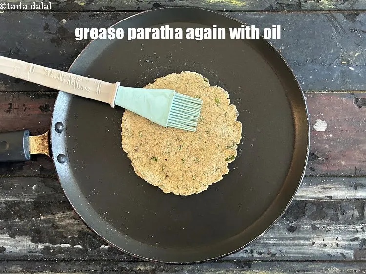 Step 19 – Grease paratha with oil&nbsp;again.