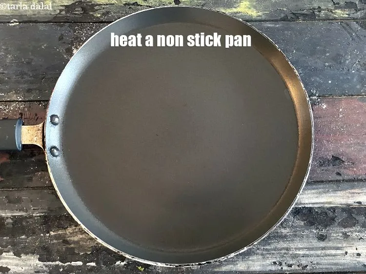 Step 18 – Heat a non-stick tava (griddle).
