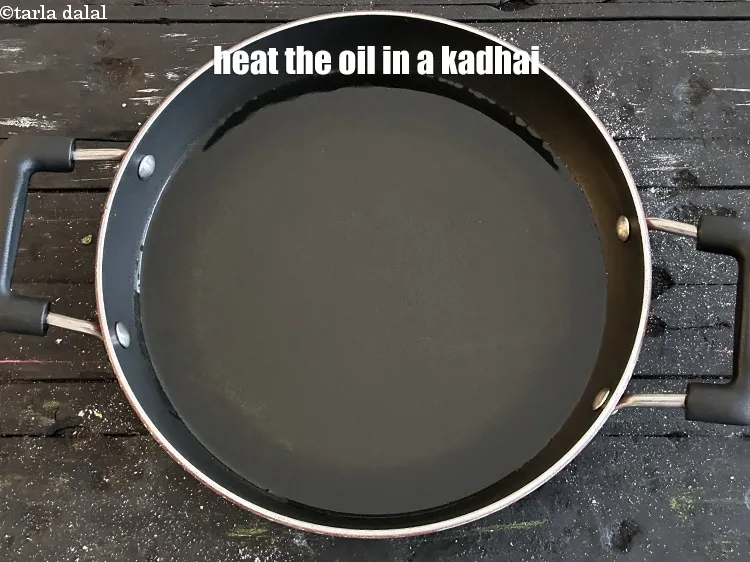 Step 18 – Heat the oil in a kadhai.