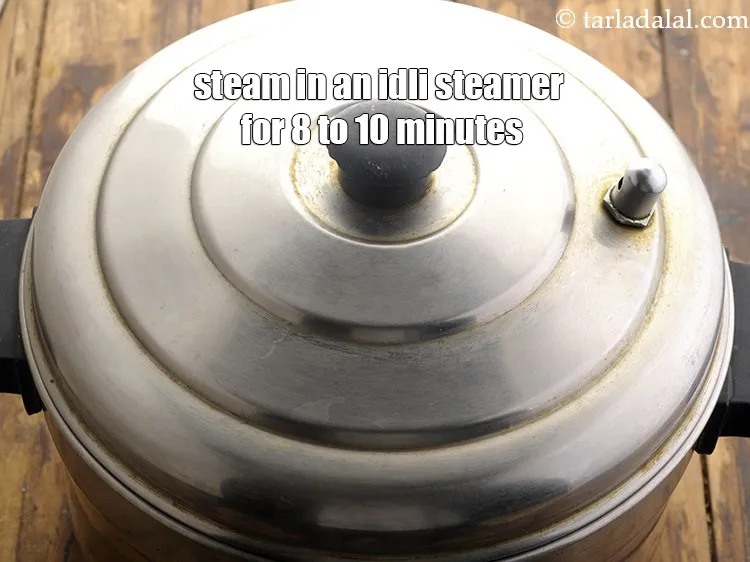 Step 18 – Steam in an idli steamer for 8 to 10 minutes or till they are cooked.