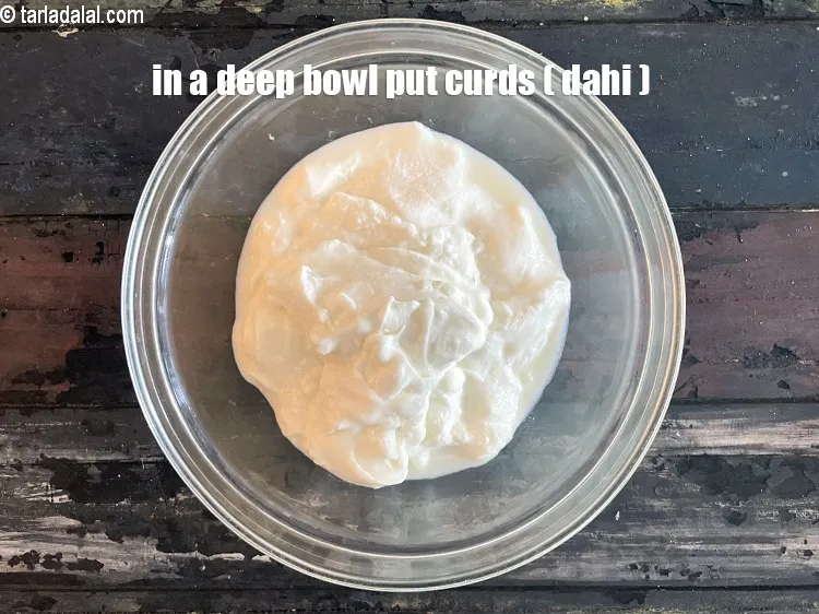 Step 18 – In a deep bowl put&nbsp;<meta charset="UTF-8" />2 cups&nbsp;<a href="glossary-curd-dahi-yogurt-yoghurt-383i">curds (dahi)</a>.