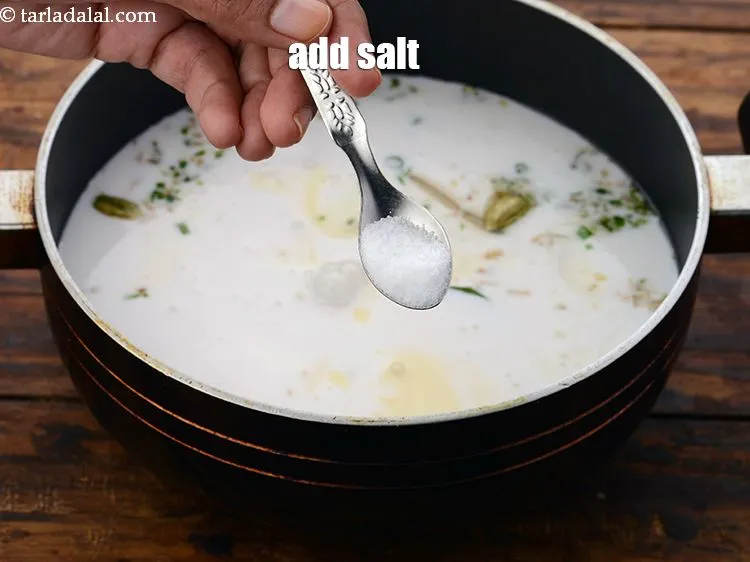 Step 27 – Add the <a href="https://www.tarladalal.com/glossary-salt-namak-table-salt-418i" target="_blank">salt</a>.