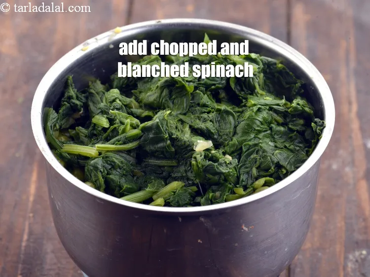 Step 17 – Add 1 cup <a href="https://www.tarladalal.com/glossary-blanched-and-chopped-spinach-1915i">chopped and blanched spinach (palak)</a>.
