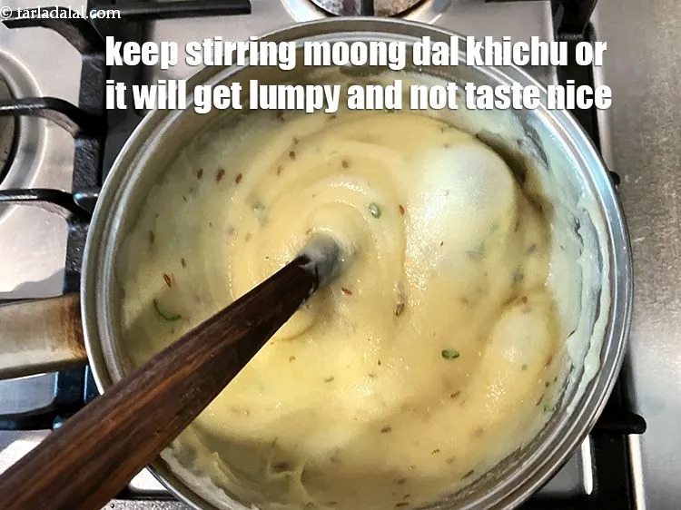 Step 25 – You must keep stirring the moong dal khichu while cooking or it will get lumpy.