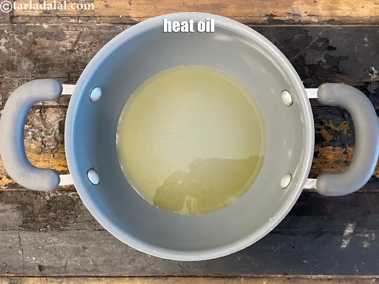 Step 36 – Heat 2 tbsp&nbsp;<a href="glossary-oil-671i">oil</a>&nbsp;in a non stick pan.