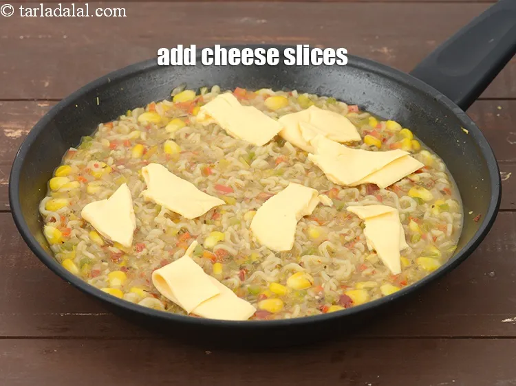 Step 18 – Add 2&nbsp;<a href="https://tarladalal.com/glossary-cheese-slices-765i">cheese slices</a>.&nbsp;