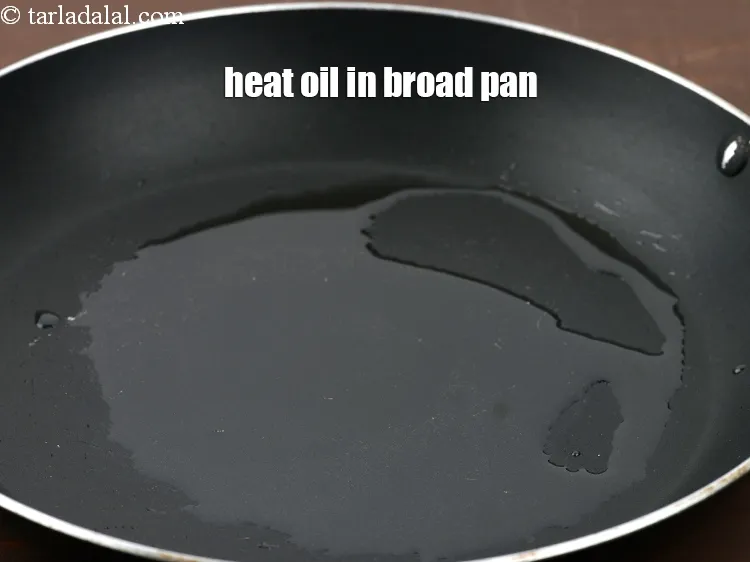 Step 17 – Heat 1 &frac12; tbsp oil in a broad non-stick pan.