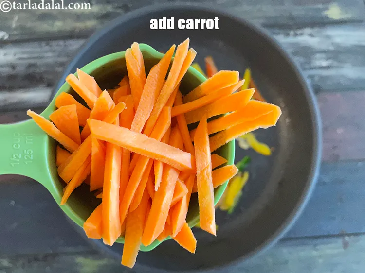 Step 18 – Add&nbsp;<meta charset="UTF-8" />1/2 cup&nbsp;<a href="glossary-diagonally-cut-carrot-2315i">diagonally cut carrot</a>.