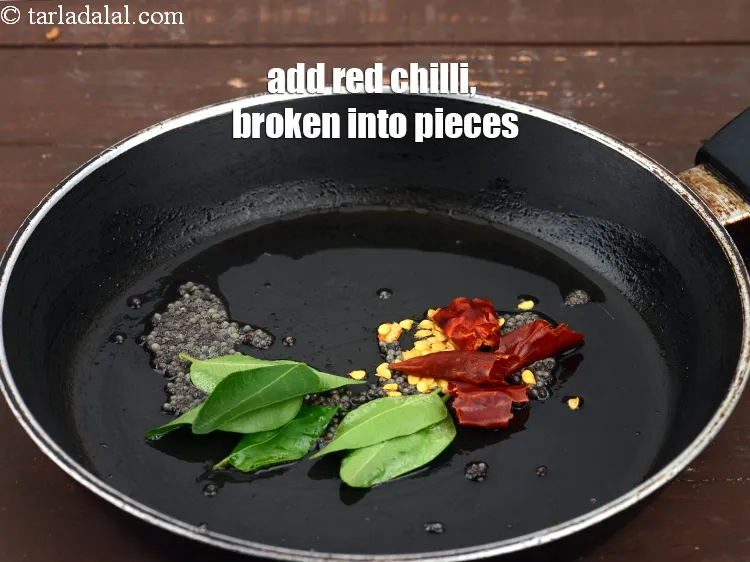 Step 18 – Add 1&nbsp;<a href="https://www.tarladalal.com/glossary-pandi-chillies-pandi-dry-red-chillies-2373i">dry red chilli (pandi)</a>, broken into pieces.
