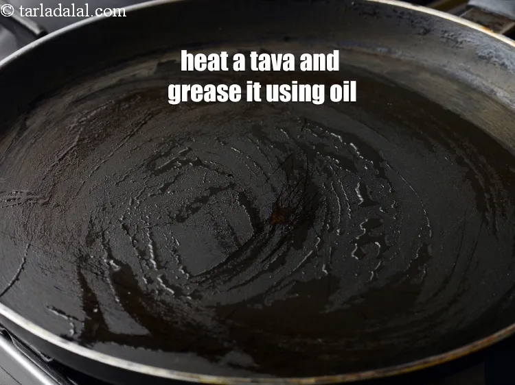 Step 17 – Heat a non-stick tava (griddle).&nbsp;Grease it using &frac14; tsp of oil.