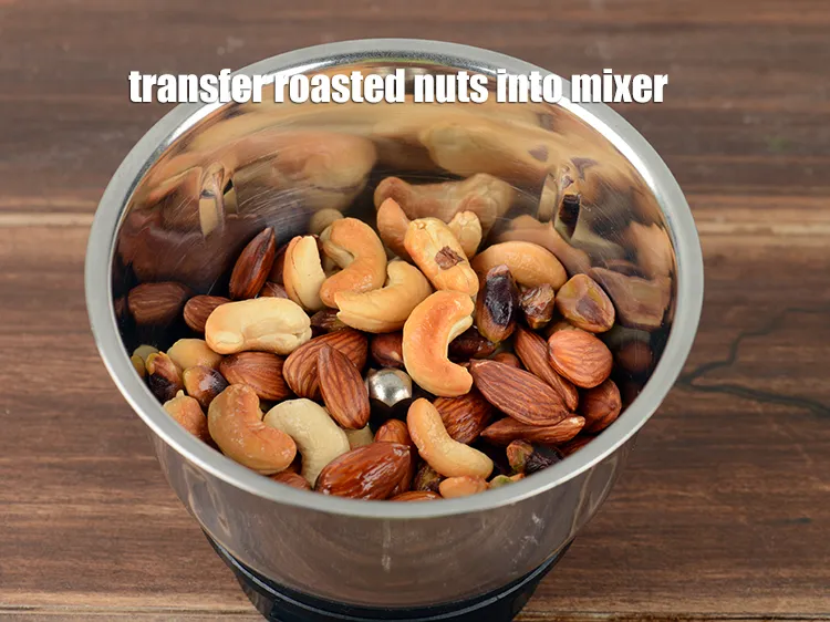 Step 18 – Transfer the roasted nuts into a mixer.