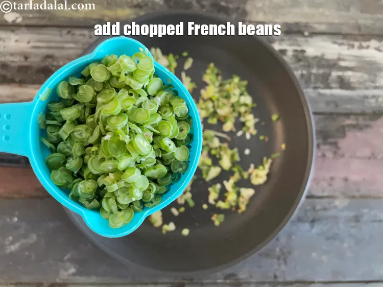 Step 17 – Add&nbsp;<meta charset="UTF-8" />1/2 cup&nbsp;finely&nbsp;<a href="glossary-chopped-french-beans-797i">chopped french beans</a>.