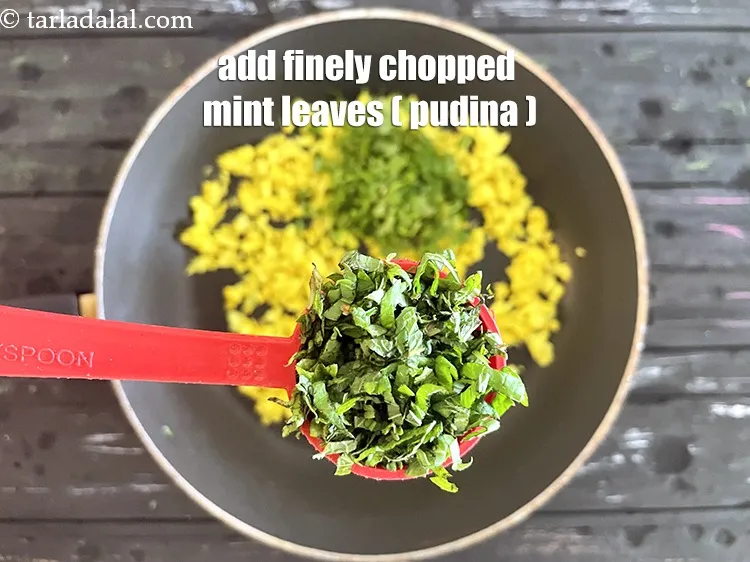 Step 19 – Add 3&nbsp;tbsp&nbsp;finely&nbsp;<a href="glossary-chopped-mint-788i">chopped mint leaves (phudina)</a>.