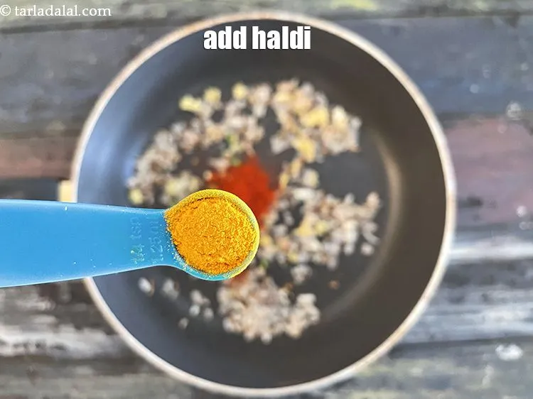 Step 21 – Add&nbsp;<meta charset="UTF-8" />1/4 tsp&nbsp;<a href="glossary-turmeric-powder-haldi-645i">turmeric powder (haldi)</a>.