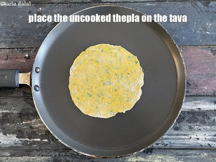 Step 18 – Place uncooked paratha on non stick pan.