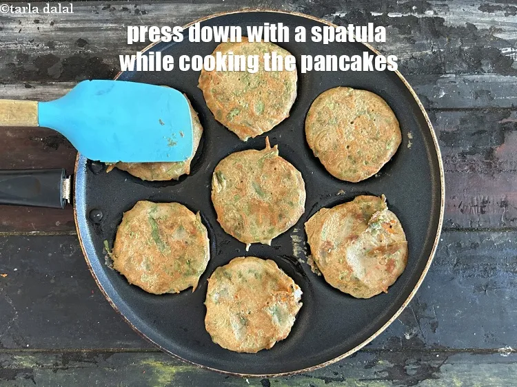 Step 18 – Press down with a spatula while cooking the pancakes.