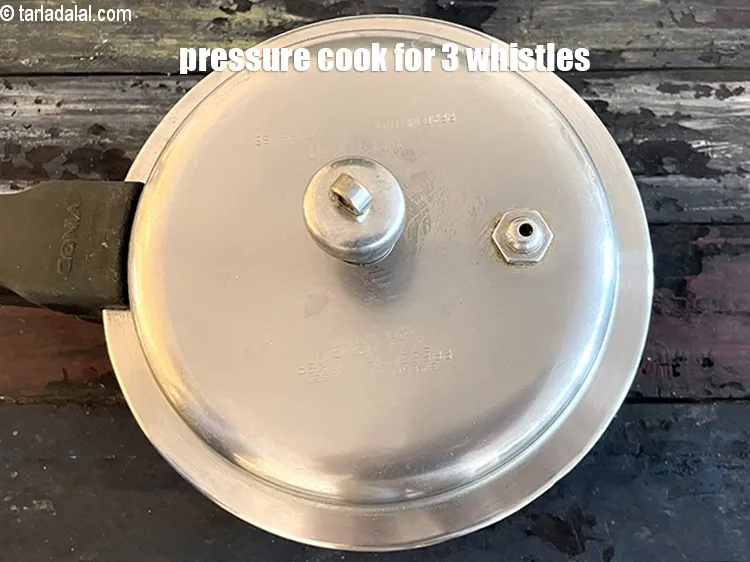 Step 18 – Pressure cook for 3 whistles or till all the pulses are cooked.&nbsp;