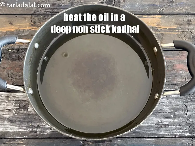 Step 18 – <meta charset="UTF-8" />Heat the oil in a deep non-stick kadhai.