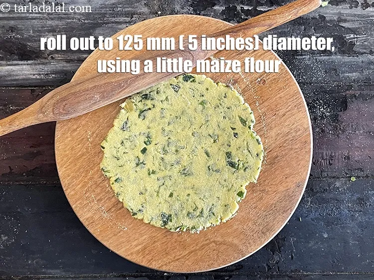 Step 18 – Roll out each portion into a 125 mm. (5&rdquo;) diameter roti, using a little maize …