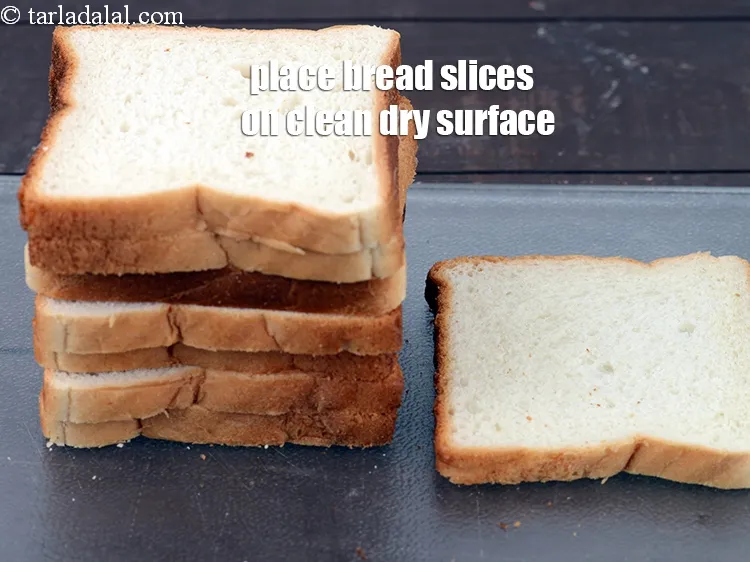 Step 18 – Place 8&nbsp;<a href="https://www.tarladalal.com/glossary-bread-219i">bread slices</a>&nbsp; on a clean, dry surface.