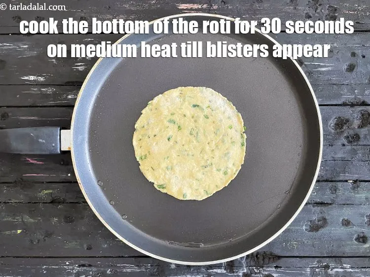 Step 19 – <meta charset="UTF-8" />Cook the bottom of the roti for 30 upto seconds on medium heat …