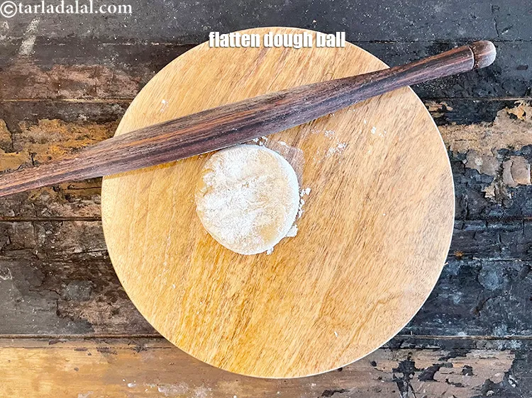 Step 19 – <meta charset="UTF-8" />Flatten the dough ball with your palms and place on the board for …