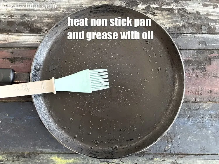 Step 21 – Heat a non-stick tava (griddle) and grease with oil.