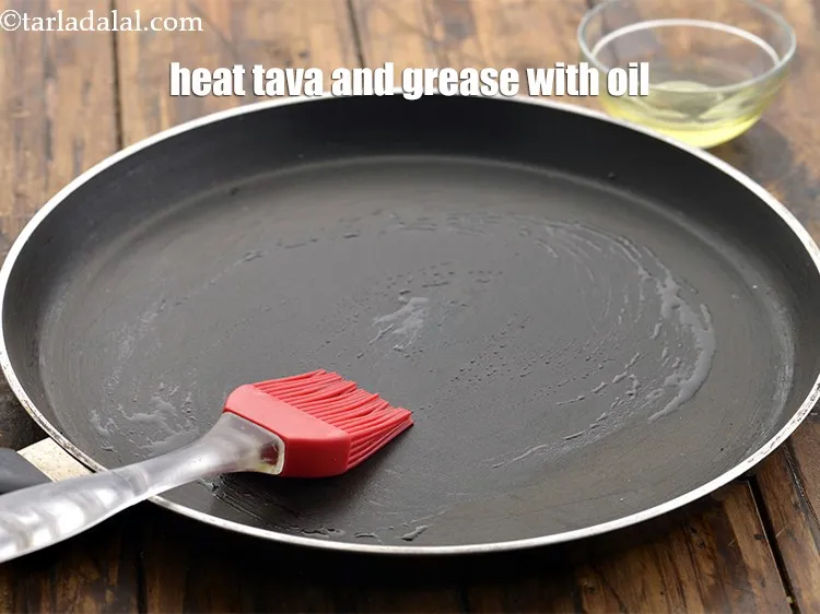 Step 17 – Heat a non-stick tava (griddle) and grease it with &frac14; tsp of oil.