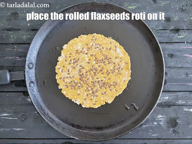 Step 21 – Place the rolled flaxseeds roti on it.