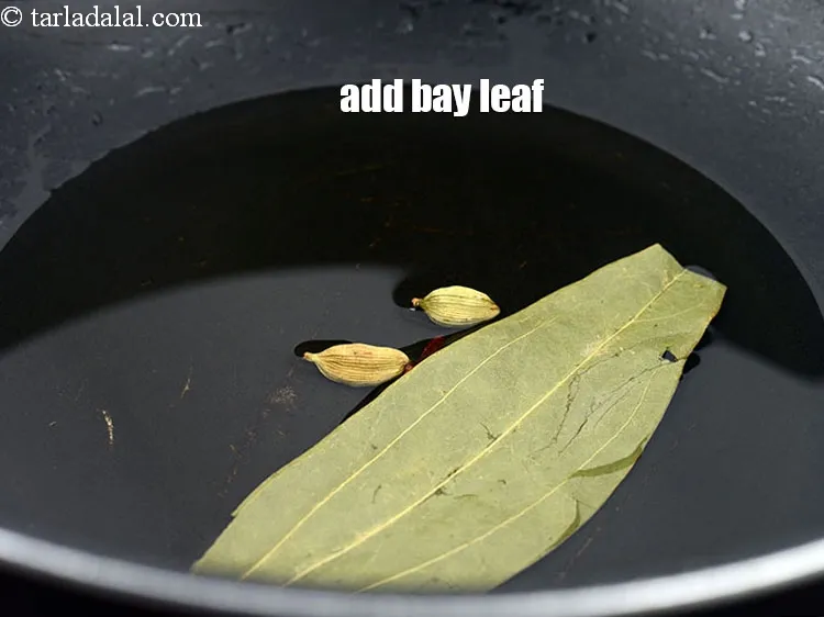 Step 18 – Add 1 <a href="https://www.tarladalal.com/glossary-bay-leaf-tejpatta-bay-leaves-189i">bay leaf (tejpatta)</a>.