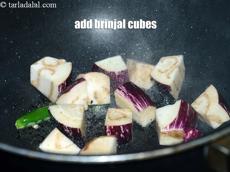 Step 19 – Add &frac12; cup <a href="https://www.tarladalal.com/glossary-brinjal-cubes-132i">brinjal (eggplant/ baingan) cubes</a>.