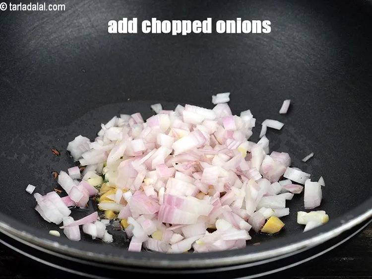 Step 18 – Add &frac12; cup <a href="https://www.tarladalal.com/glossary-chopped-onions-722i">chopped onions</a>.