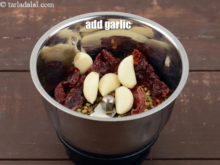Step 19 – Add 5 to 6 <a href="https://www.tarladalal.com/glossary-garlic-lehsun-lahsun-348i">garlic (lehsun)</a>.