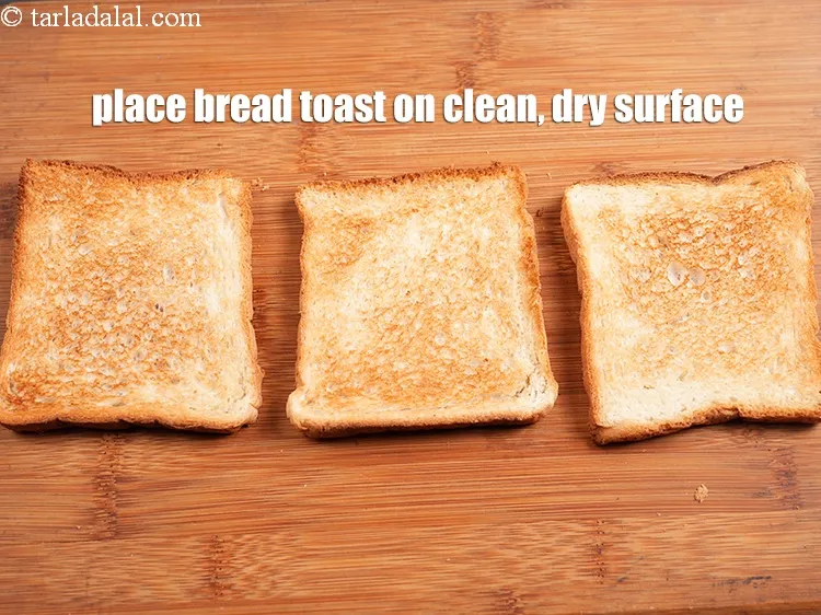 Step 20 – Place 3 <a href="https://www.tarladalal.com/glossary-bread-toast-toasted-bread-1660i">bread toast</a> on a clean, dry surface.