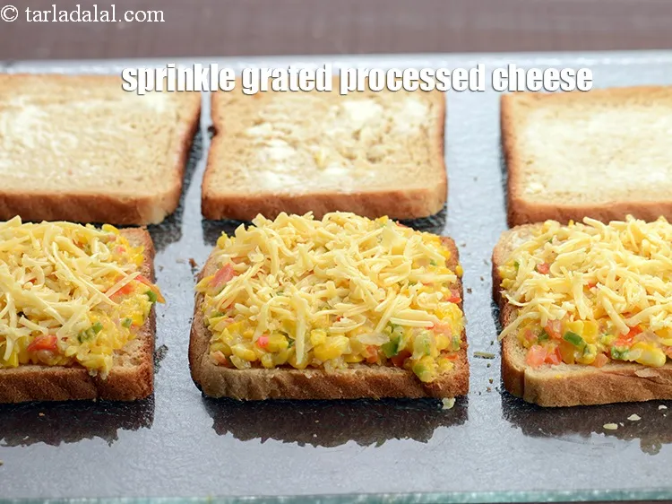 Step 18 – Sprinkle 1 tbsp <a href="https://www.tarladalal.com/glossary-grated-processed-cheese-868i">grated processed cheese</a>.