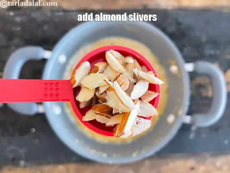 Step 25 – <html><head></head><body><p>Add&nbsp;1 tbsp&nbsp;<a href="glossary-almond-slivers-slivered-almonds-664i">almond (badam) slivers</a>.</p></body></html>